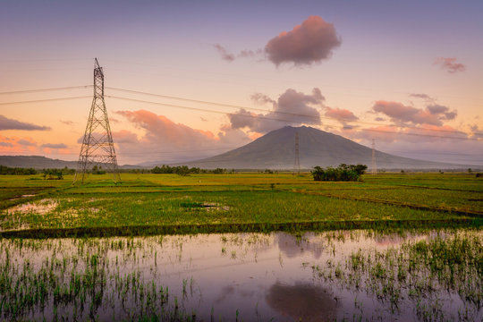 Morning Shot of Mt. Iriga with rice paddies and an electric pylon.