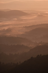 Twilight, sunrise and sea of fog in the morning on the mountains of northern Thailand, during the rainy season.