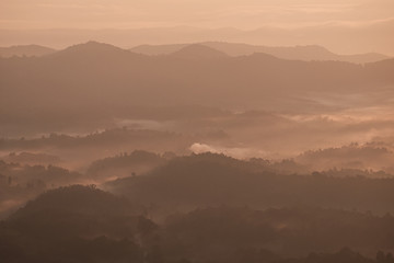 Twilight, sunrise and sea of fog in the morning on the mountains of northern Thailand, during the rainy season.