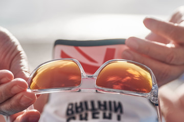 sunglasses on the beach by the ocean
