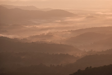 Twilight, sunrise and sea of fog in the morning on the mountains of northern Thailand, during the rainy season.