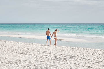 Girl swimming in the ocean with her boyfriend