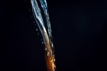 Water motion orange&blue, black background