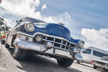 beautiful retro cars, palm trees and clouds