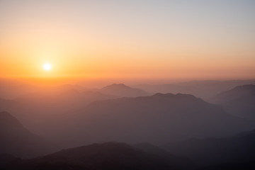 Twilight, sunrise and sea of fog in the morning on the mountains of northern Thailand, during the rainy season.