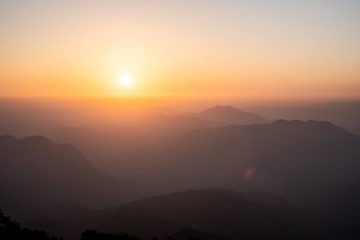 Twilight, sunrise and sea of fog in the morning on the mountains of northern Thailand, during the rainy season.