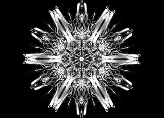 White on black powerful glowing abstract flame mandala flower. Ornamental floral pattern on black background.