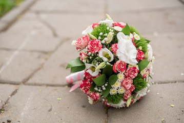 Bridal bouquet of roses, eustoma and ornamental plants
