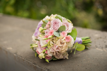 Bridal bouquet of roses, eustoma and ornamental plants
