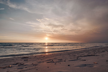Stunning colorful sunset on a sandy beach.