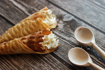 Russian waffles with cream cheese and spices. Wafer rolls on the table. Delicious waffles