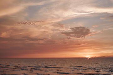 Stunning colorful sunset on a sandy beach.