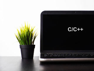 C plus programming language. Programming training, the concept of computer courses. Laptop on the table