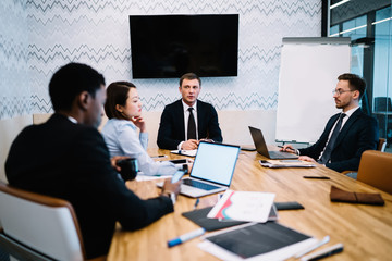 Multiracial business colleagues working in office