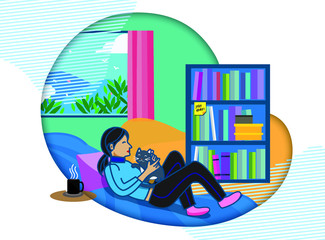 Woman laying on the sofa and playing with her cat. Practice social distance and stay home during coronavirus outbreak period.