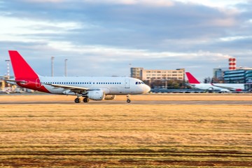 Fototapeta premium Aircraft take-off into the sky against the background of the airport