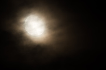 The Moon Three Days after Its Full Shape Surrounded by Thin Clouds on a Beautiful Spring Night