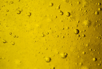 Abstract colorful background. Foam of Soap with Bubbles macro shot. Closeup bubbles in water. Oil drops on a water surface abstract background. Aqua Blue bubbles. Blue water and soap bubbles wallpaper