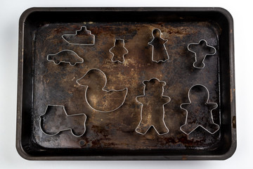 metal cookie cutters on baking tray