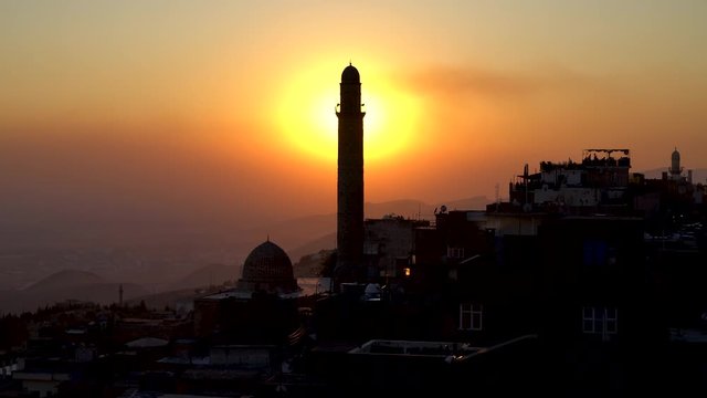 Mardin, Turkey - January 2020: Minaret of Ulu Cami, also known as Great mosque of Mardin during sunset