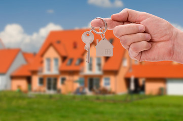 newly built home with a yardstick house key