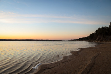 Fototapeta na wymiar Blue riverside sunset in late evening.
