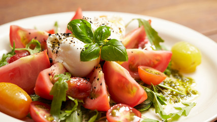 fresh salad with tomatoes and mozzarella