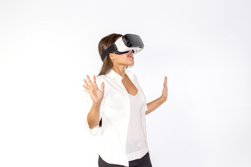 Beautiful Girl tries VR headset on white background