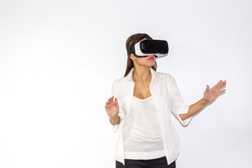 Beautiful Girl tries VR headset on white background