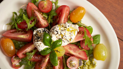 fresh salad with tomatoes and mozzarella