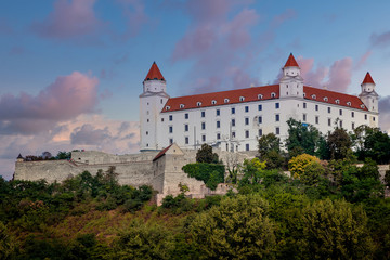 Evening view of the old famous  Bratislava Castle up on the hill with surrounding wall.
