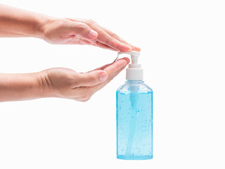 Close-up at hands while use hand sanitizer gel in plastic pump bottle isolated on white background with clipping path. Hand sanitizer gel for cleaning hands and prevent bacteria or virus, coronavirus.