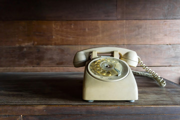 dialing or scrolling phone on wooden table