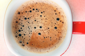 Coffee foam texture close up in cup on top view. macro shop of coffee foam. Breakfast, caffeine, selective focus