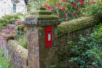 UK red post box in a brick pillar - Powered by Adobe