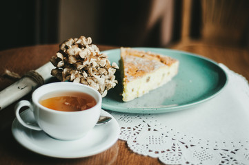 Slice of homemade apple pie with coffee