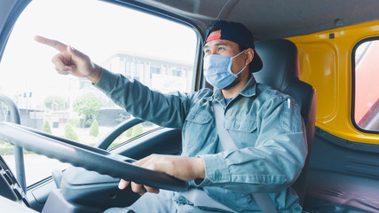 Truck drivers wear a medical facemask for protection. During the coronavirus outbreak