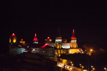 Fototapeta na wymiar fortress with yellow illumination in the night