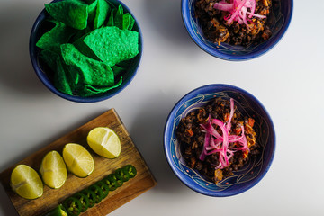 Black bean chili with condiments and chips