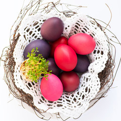 Easter eggs in pastel colors in the nest