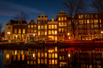 Fototapeta na wymiar City scenic from Amsterdam at the Amstel in the Netherlands at night