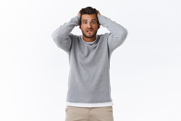 Worried handsome, troubled hispanic bearded guy caught cheeting, looking anxious and troubled,...
