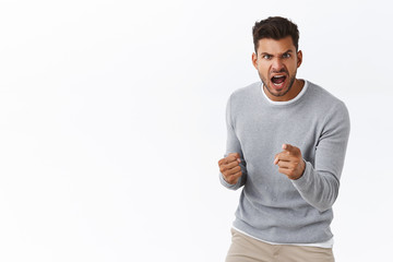 Man threatening person with angry outraged expression, lose temper standing distressed, pointing...