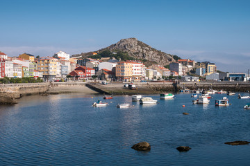 Fototapeta na wymiar Fishing port of Muxia, a small coastal town and tourist destination at the Coast of Death, La Coruna, Galicia, Spain