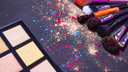 Cosmetics and beauty, still life with a palette of shadows and makeup brushes,