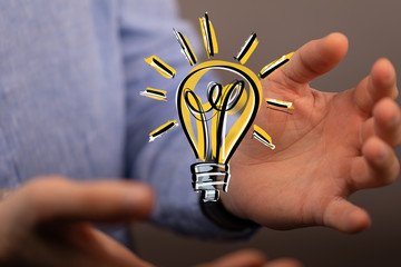 idea lamp concept in hand.