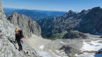 Fototapeta na wymiar Passage via ferrata with a large exposure and an amazing view of the mountain range and the glacier