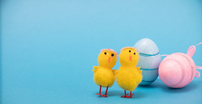 Easter eggs and chiks on blue background.