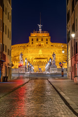 Fototapeta na wymiar View to the Castel Sant Angelo and the Sant Angelo bridge in Rome at night