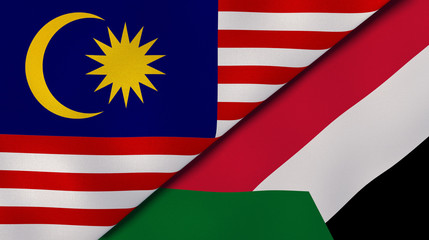 The flags of Malaysia and Sudan. News, reportage, business background. 3d illustration